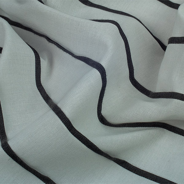 Fr Jacquard polyester fabric with three-dimensional pleated  pattern.<br /> 100% Made in Italy fabric. Style modern and trendy with plain, jacquard structures, small drawings and stripes decorations.

 Treatments: embossing 3D effect and soft hand. Type of workings: jacquard and pleated. 