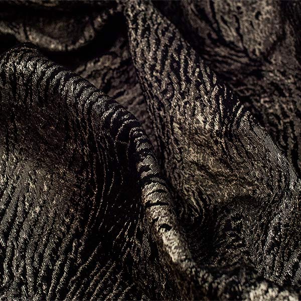 Jacquard fabric relief  rino design width cm. 320.<br /> 100% Made in Italy fabric. Style modern and trendy with fancy, plain and jacquard structures decorations.

 Treatments: embossing 3D effect and soft hand. Type of workings: jacquard. 