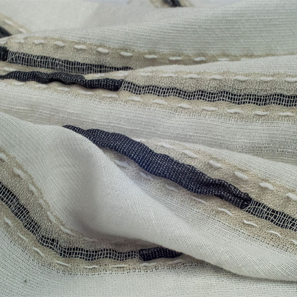 Linen blend jacquard 3d plisseè with sewing wffect.<br /> 100% Made in Italy fabric. Style modern and trendy with plain, jacquard structures, small drawings and stripes decorations.

 Treatments: embossing 3D effect and soft hand. Type of workings: jacquard and pleated. 